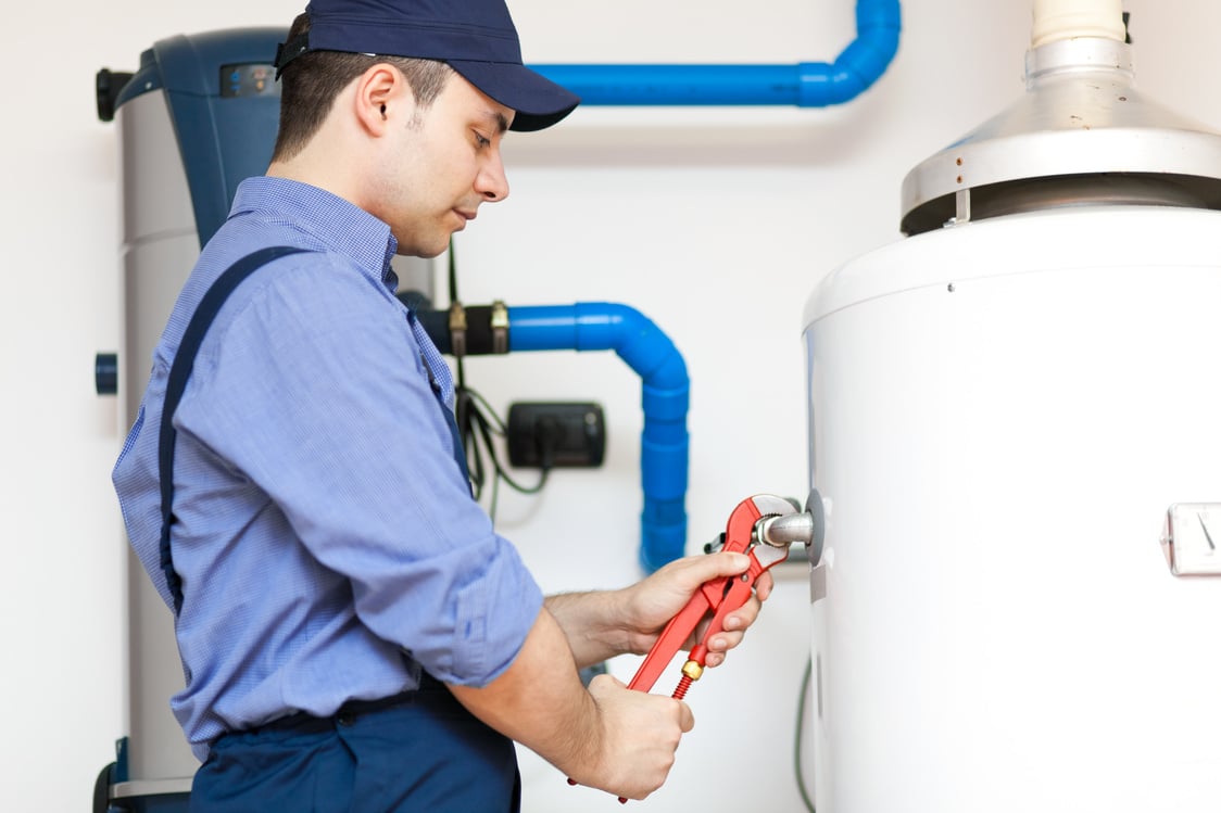 Technician repairing an hot-water heater